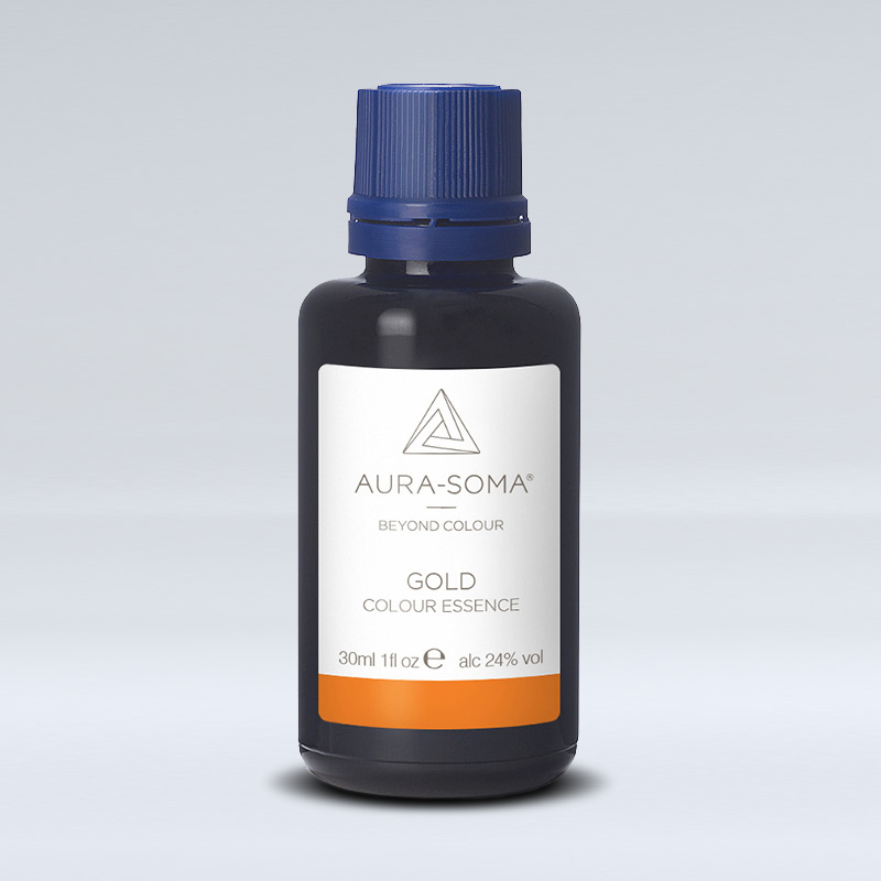 Die Farbessenz gold ist in einer braunen Glasflasche mit Etikette auf der der Schriftzug Gold und das Logo von Aura-Soma zu sehen ist